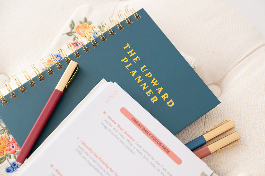 Upward Planner for Christian moms on a summer table