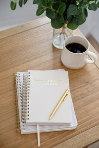 Kind Birdie journal on a coffee table. 