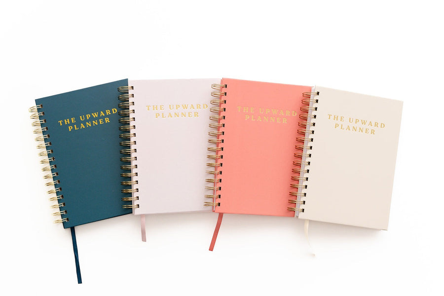 Kind Birdie Upward Planner Annual Bundle, four spiral-bound Christian planners in teal, pale pink, coral, and cream.