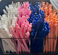 Kind Birdie bundle of pens in white, pink, navy blue, and coral. Includes planner, journal, notebook, and deck.